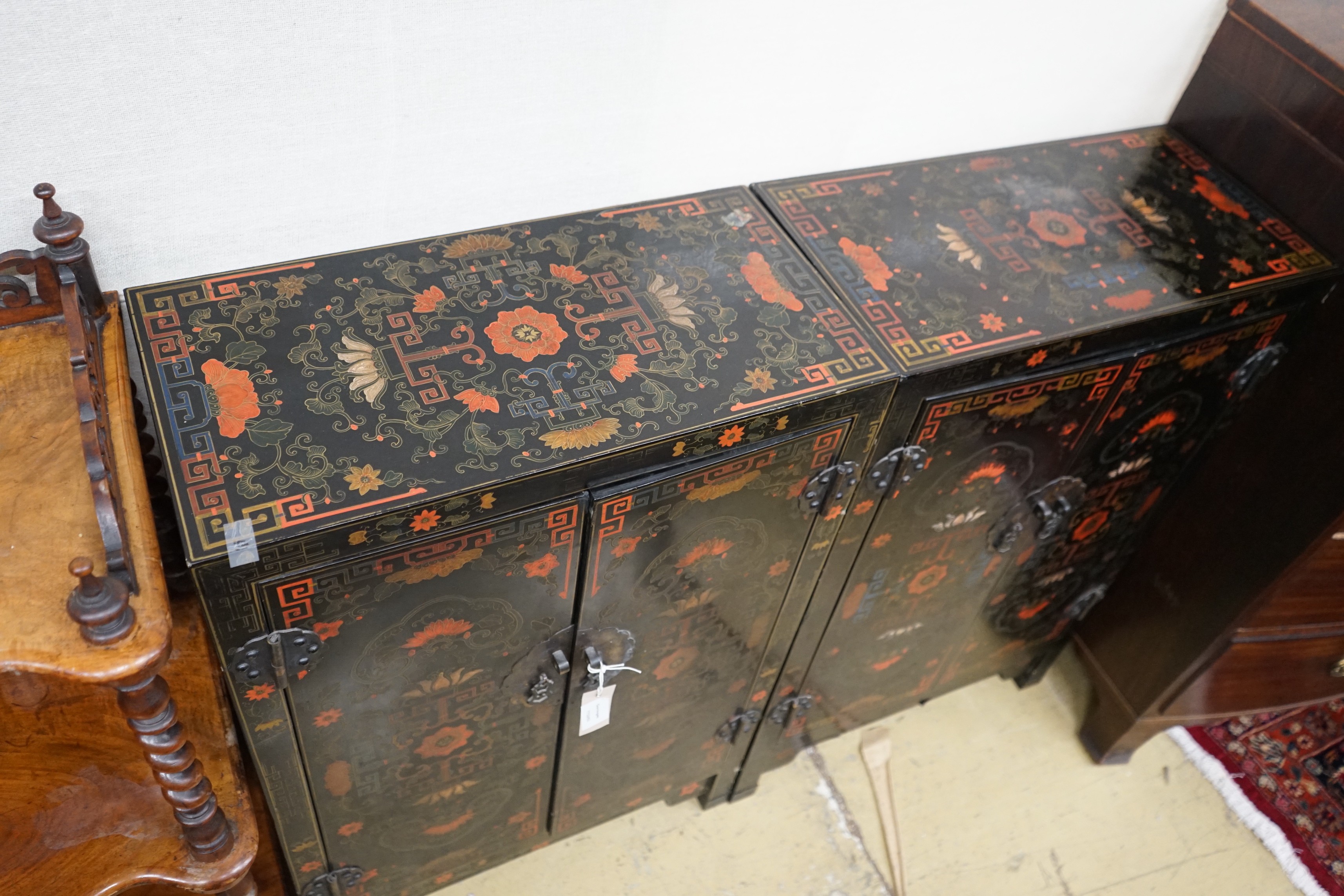 A pair of Chinese painted two door side cabinets, width 61cm, depth 31cm, height 93cm